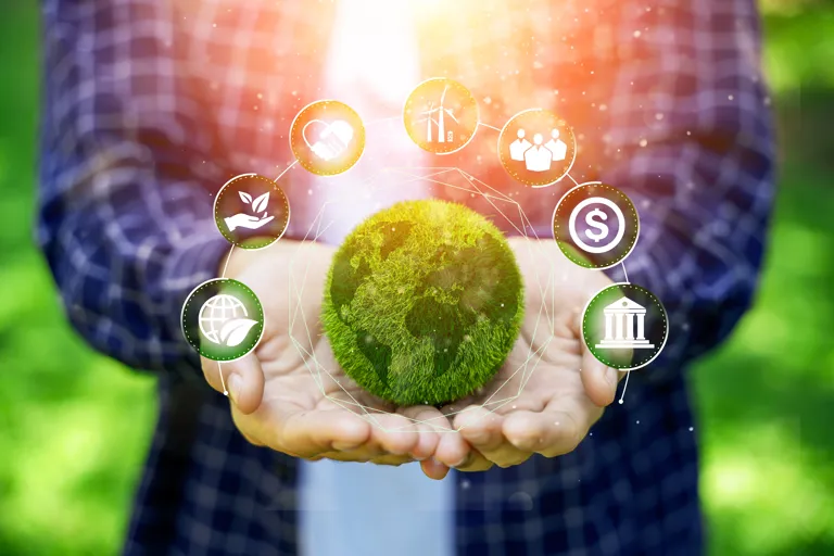 Green Planet In Hands